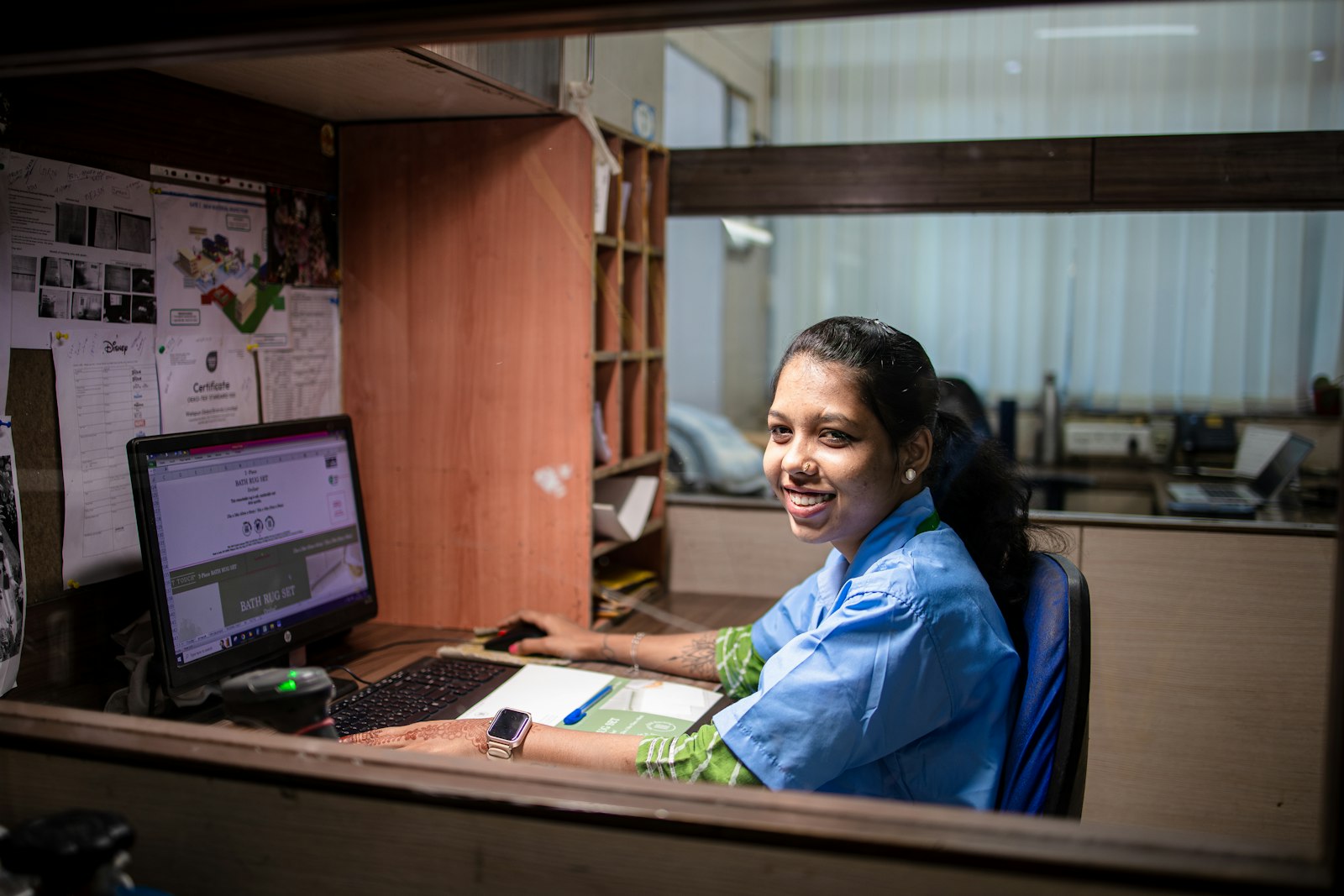 Receptionist smiling at the front desk