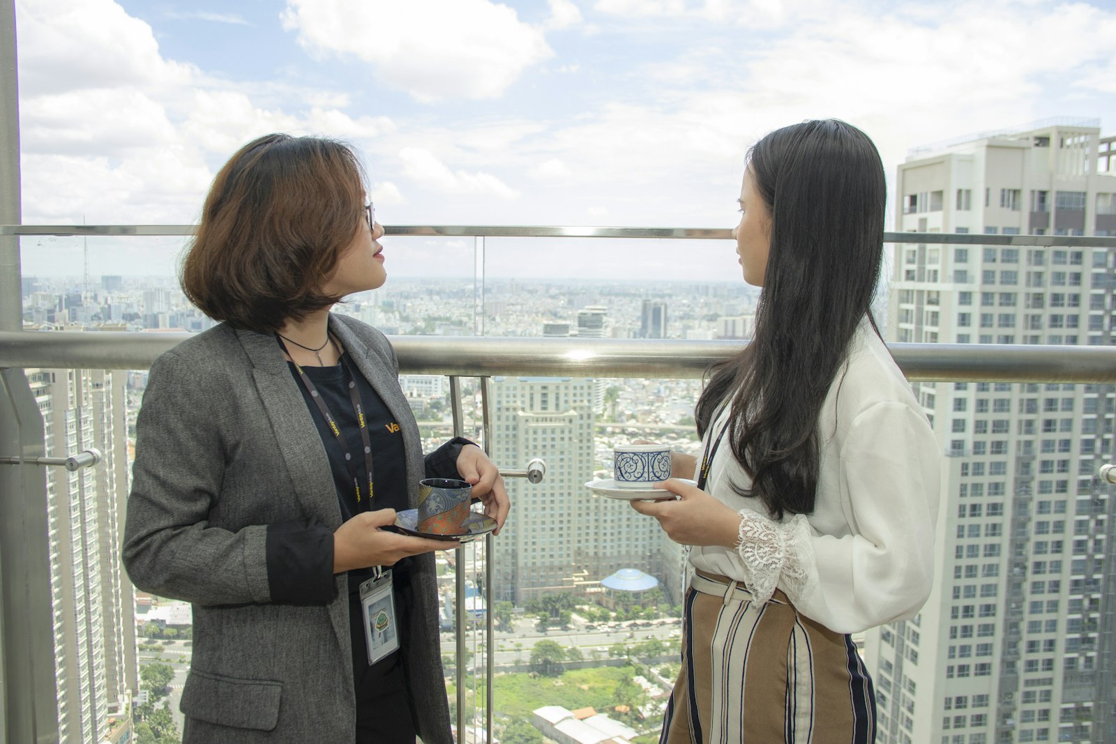 Sales agent showing a client the view from a condo
