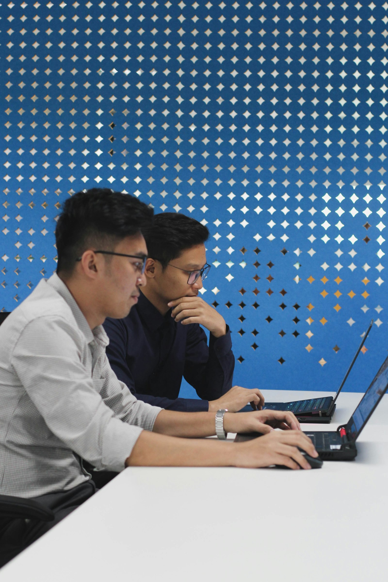 Two colleagues working together at a laptop