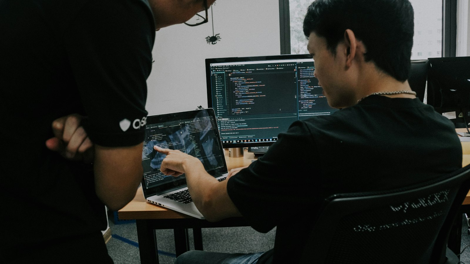 An Asian development team working at computers