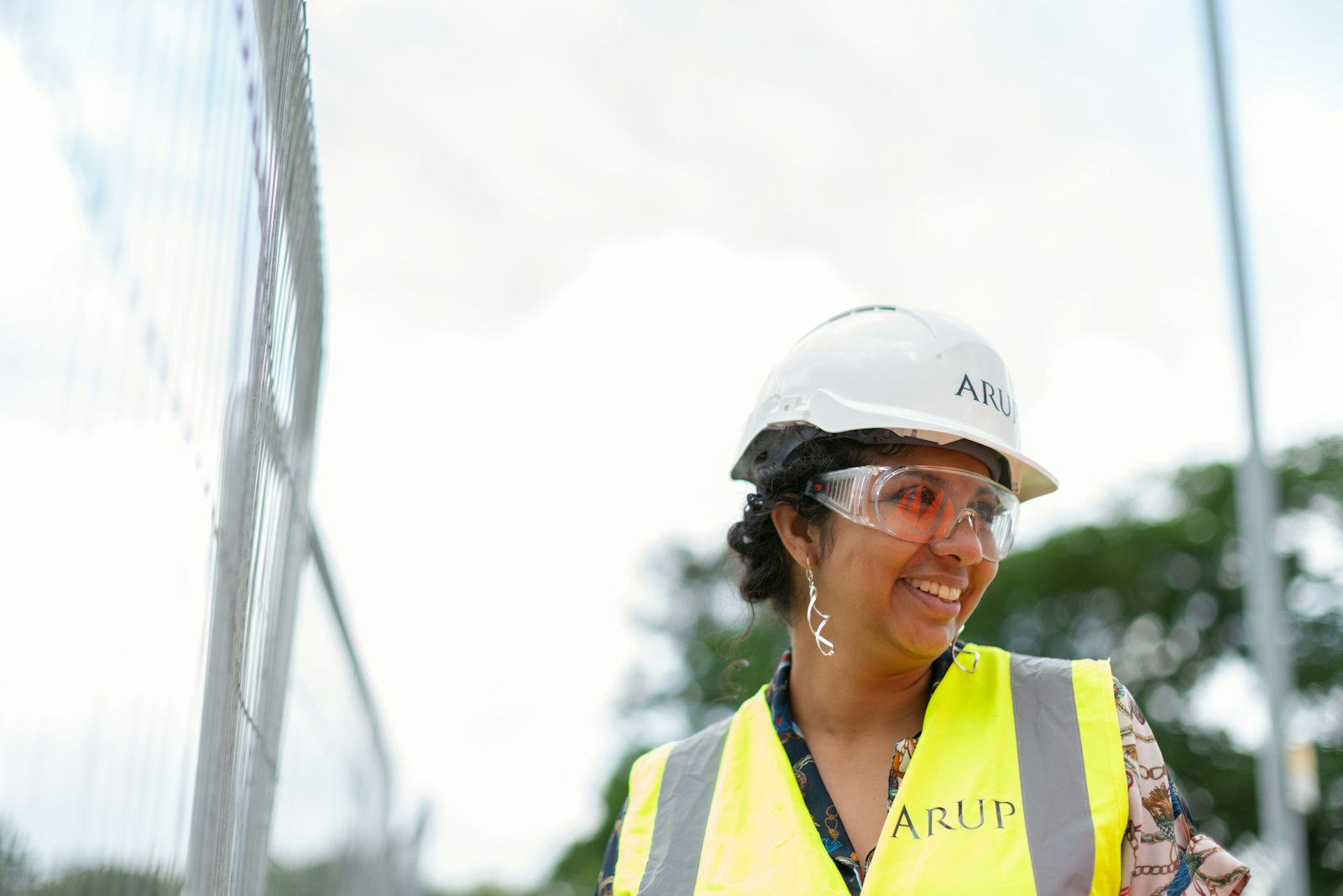 An Asian engineer wearing a safety helmet